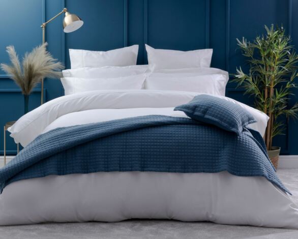 How do I make my bed look more luxurious?