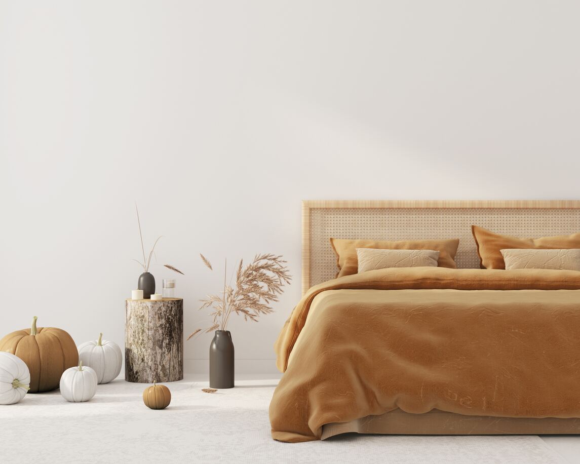 Bedroom interior with autumn coloured bedding