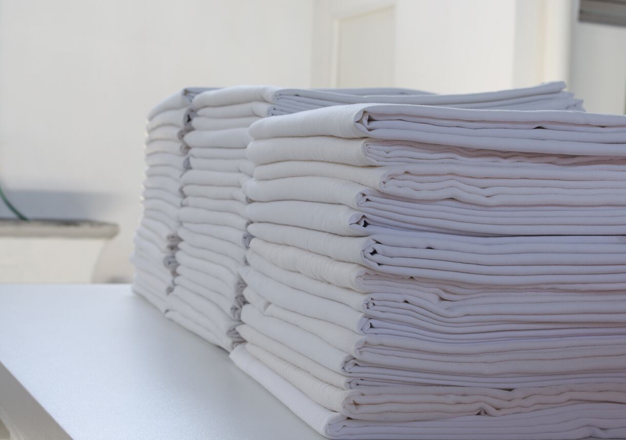 Selection of white folded bed sheets