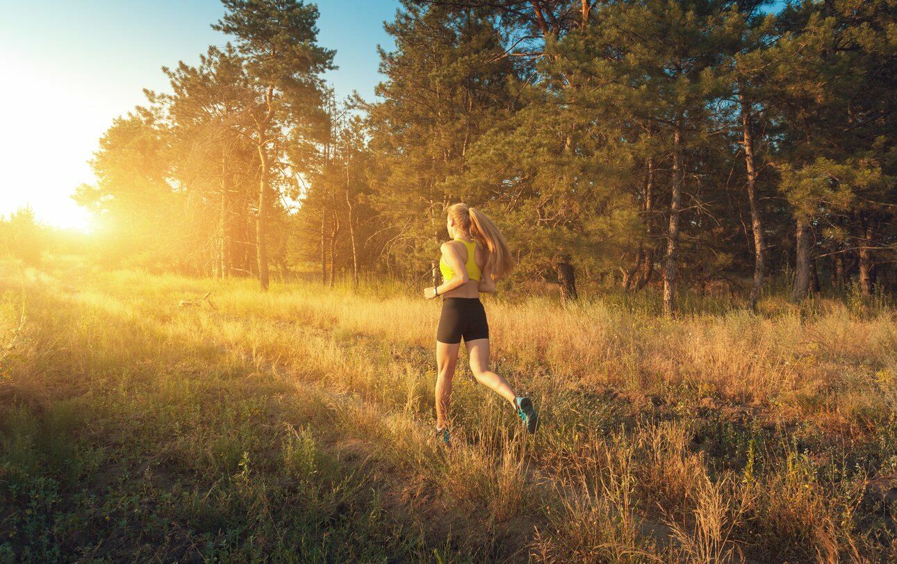 Girl jogging in a field